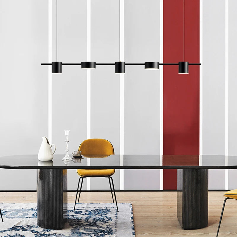 Langford matt black linear pendant lighting the full length of a dining table