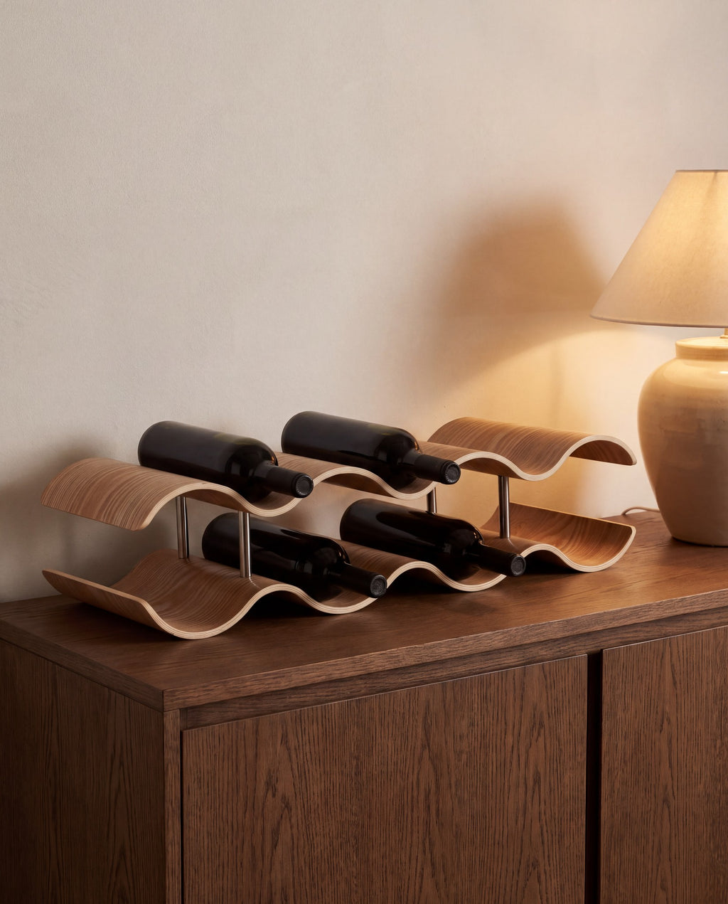 Kungsbacka wavy wine rack holding bottles on a sideboard