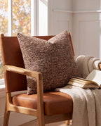 Nassjo brown cushion on a leather lounge chair