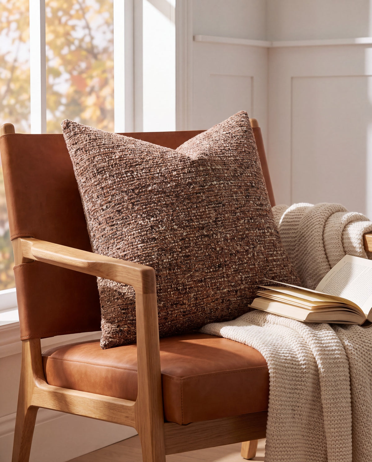 Nassjo brown cushion on a leather lounge chair