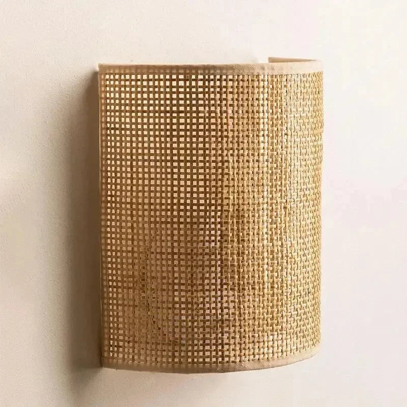 Struer rattan wall light, lit