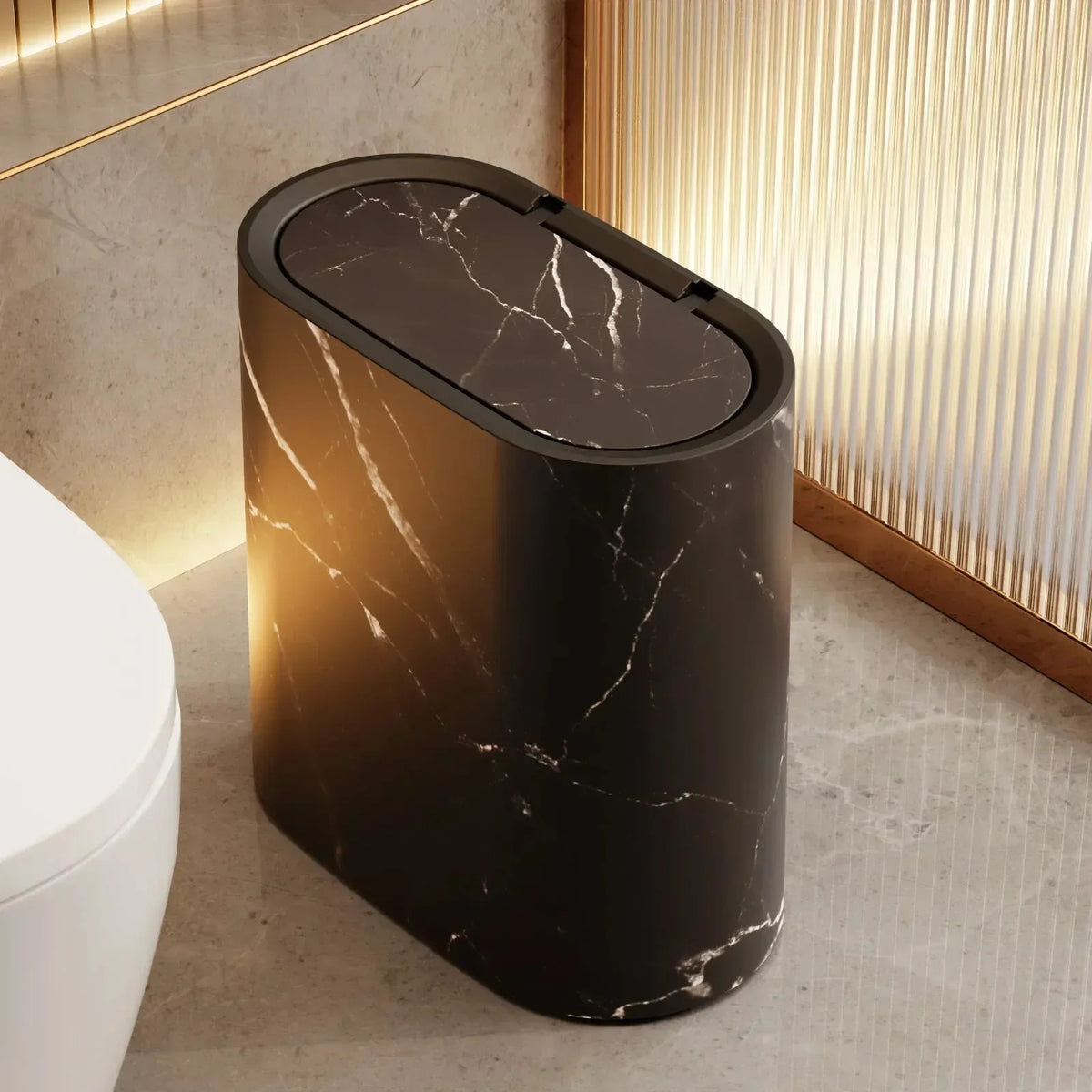 Black marble-effect slim bin beside a bathroom toilet