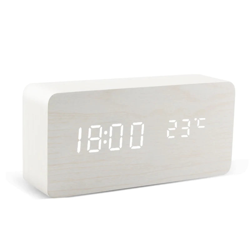 White LED alarm clock showing time and temperature