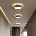 Tilbury ceiling lights lit along a hallway ceiling