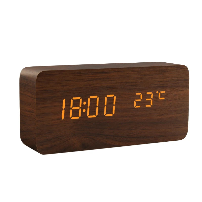Dark wood LED alarm clock showing time and temperature