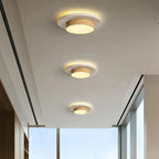 Tilbury travertine and walnut ceiling lights in a bright corridor