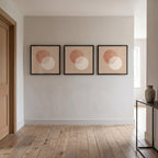 Three Bacharach album cover frames in a row on a hallway wall
