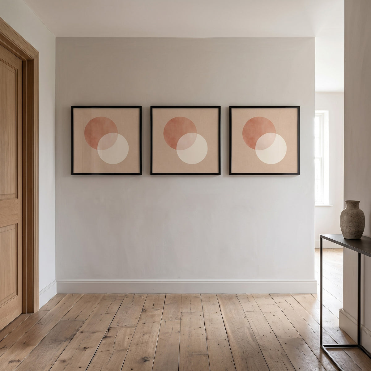Three Bacharach album cover frames in a row on a hallway wall