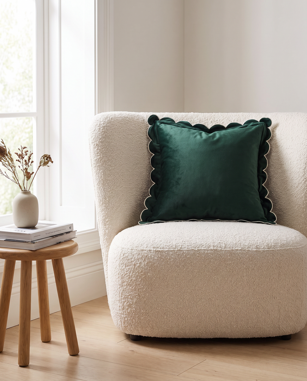 Bocholt scalloped velvet cushion on an armchair