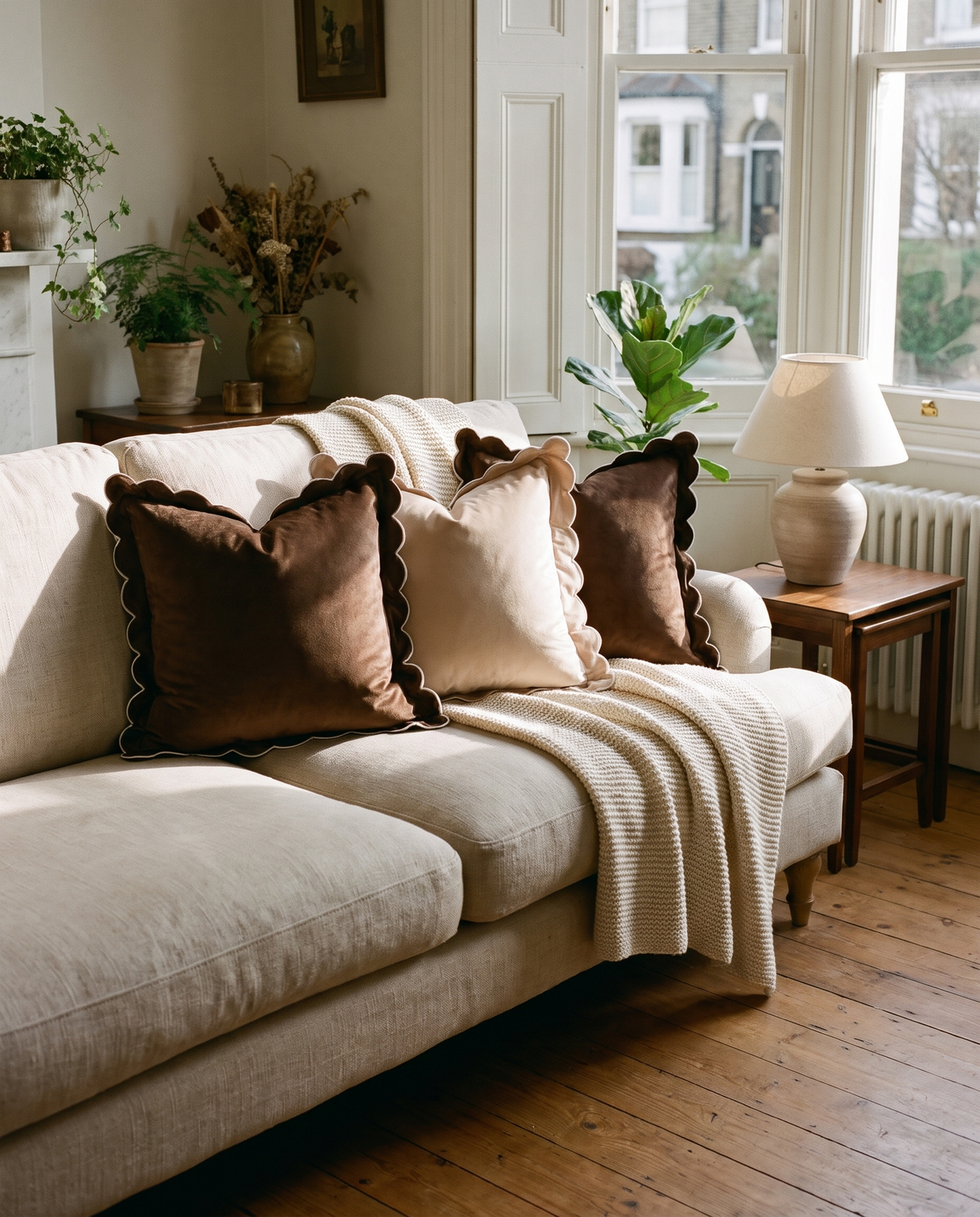Bocholt scalloped velvet cushions on a sofa