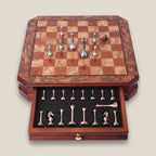 Brugge chess set with its foam lined drawer open, holding the metal pieces