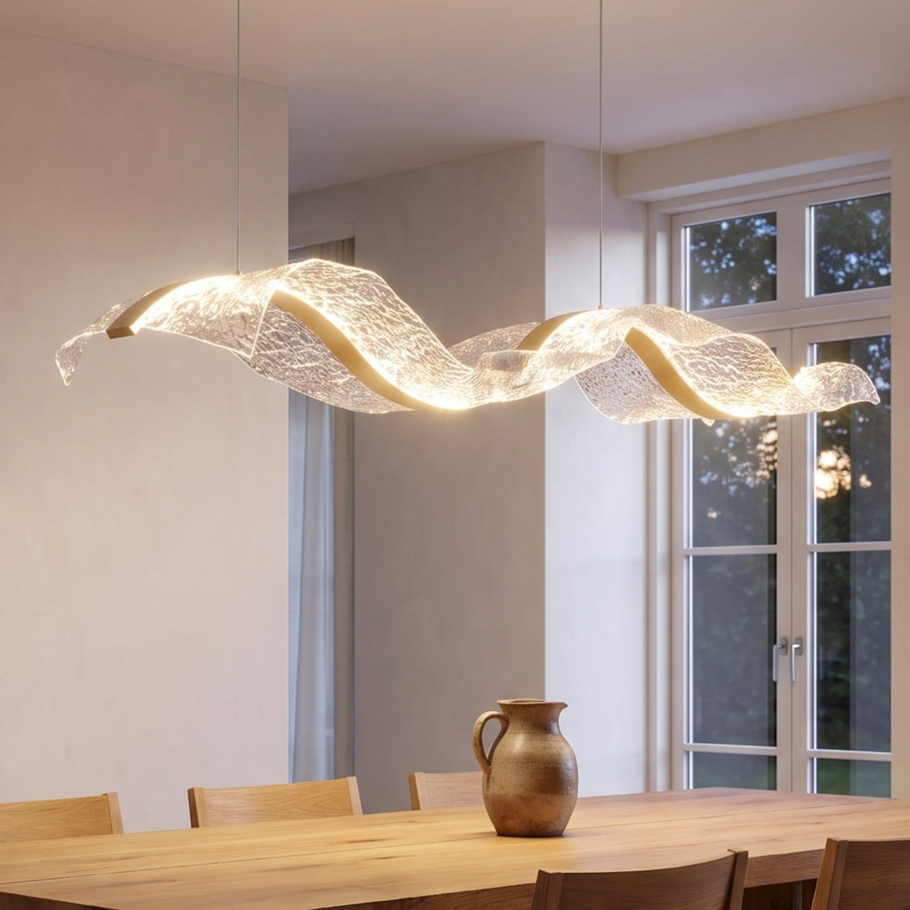 Binz wave pendant glowing over a dining table