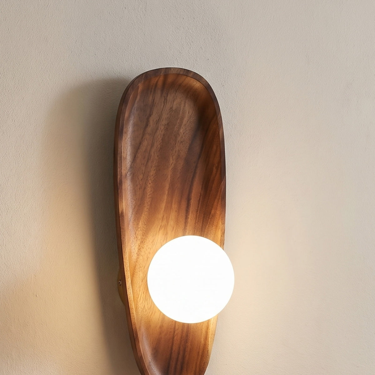Marstal wall light switched on, wood grain detail