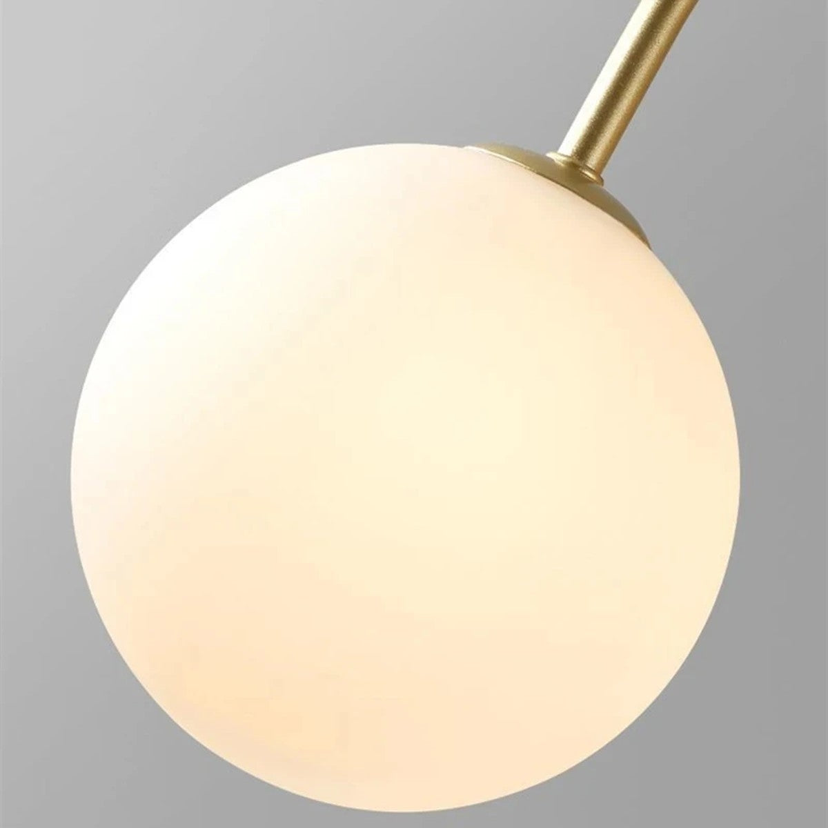 Close up of an Eckernforde frosted opal glass globe on its arm