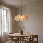 Fussen petal pendant lit over a round oak dining table in a Georgian dining room