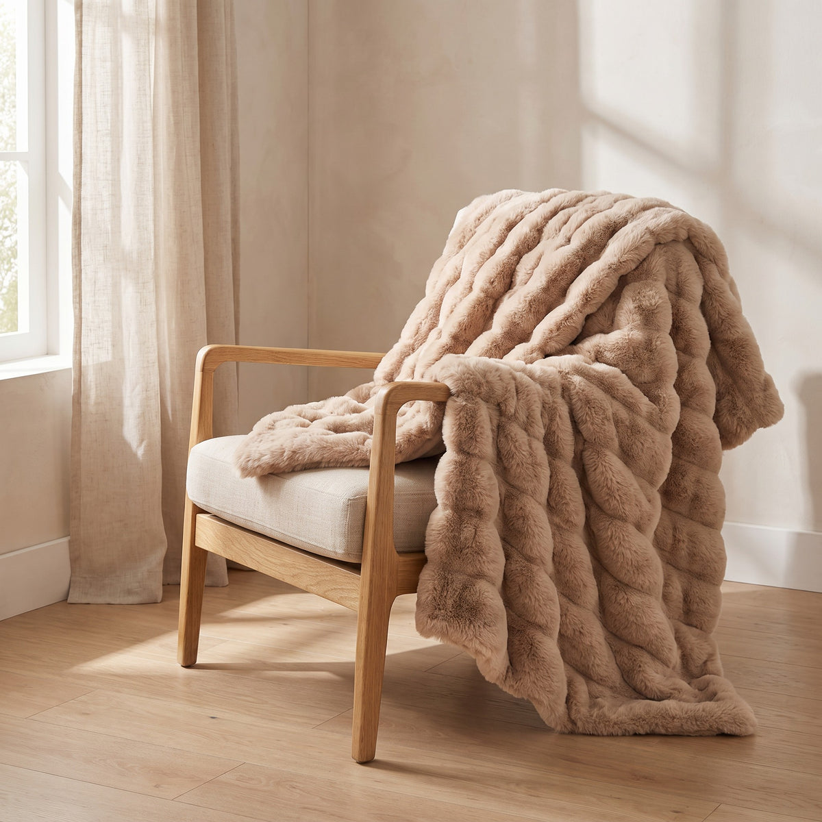Gent camel faux fur throw over an oak lounge chair