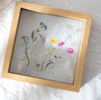 Hallstatt natural oak tone floating frame with pressed flowers, product photo