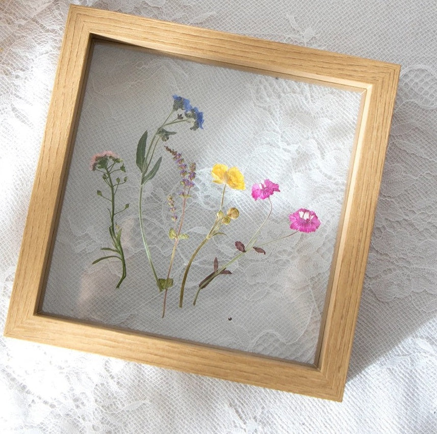 Hallstatt natural oak tone floating frame with pressed flowers, product photo