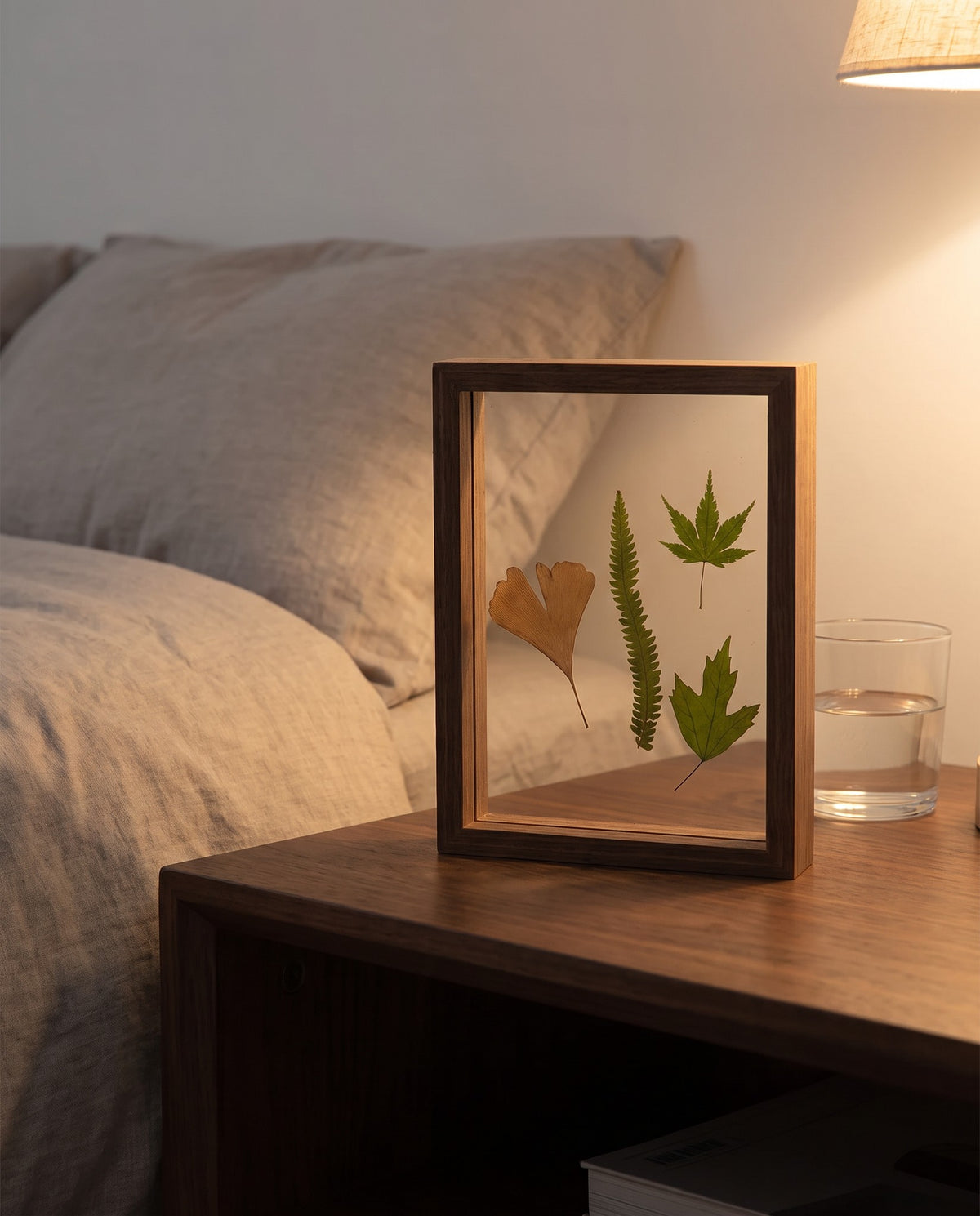 Hallstatt walnut tone floating frame on a bedside table