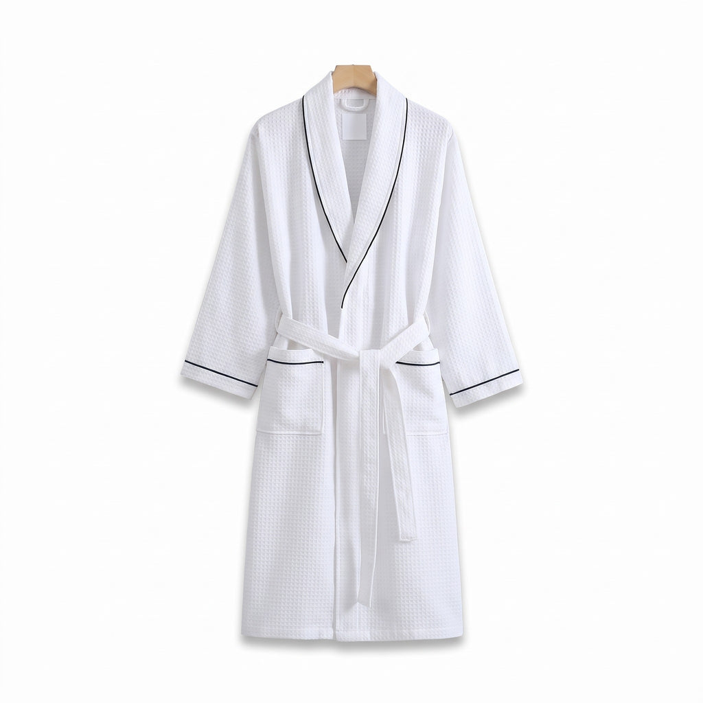 Heringsdorf cotton waffle robe in White with black piping on a white background