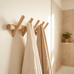 Oak wall rack holding towels in a bathroom