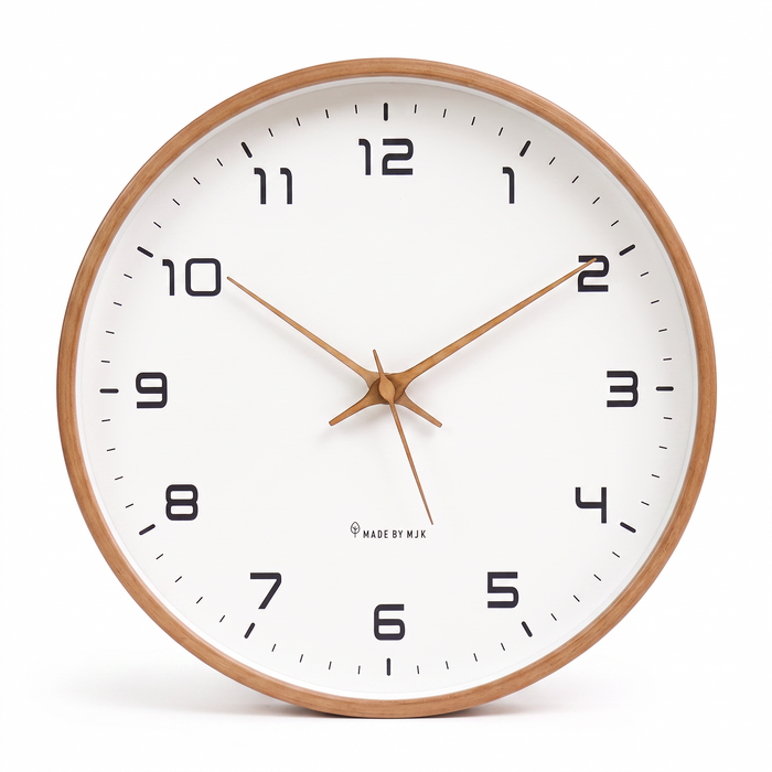 Wooden wall clock with white face on a white background
