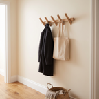 Solid oak wall rack with coats hanging in a hallway
