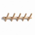 Solid oak wall rack with five pegs on a white background