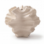 Cream sculptural wave vase on a white background