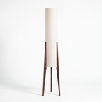 Wetherby wooden tripod floor lamp with ivory fabric column shade on a white background