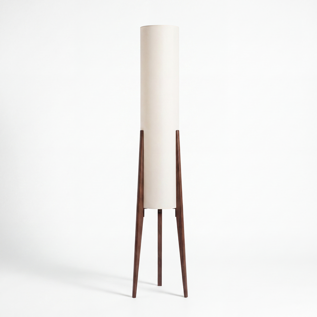 Wetherby wooden tripod floor lamp with ivory fabric column shade on a white background
