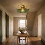 Melford green petal glass ceiling light lit in an English entrance hall