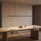 Langford five light linear pendant lighting the full length of an oak dining table