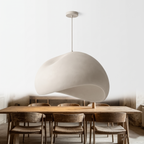 Rothwell sculpted cream dome pendant light above a reclaimed dining table