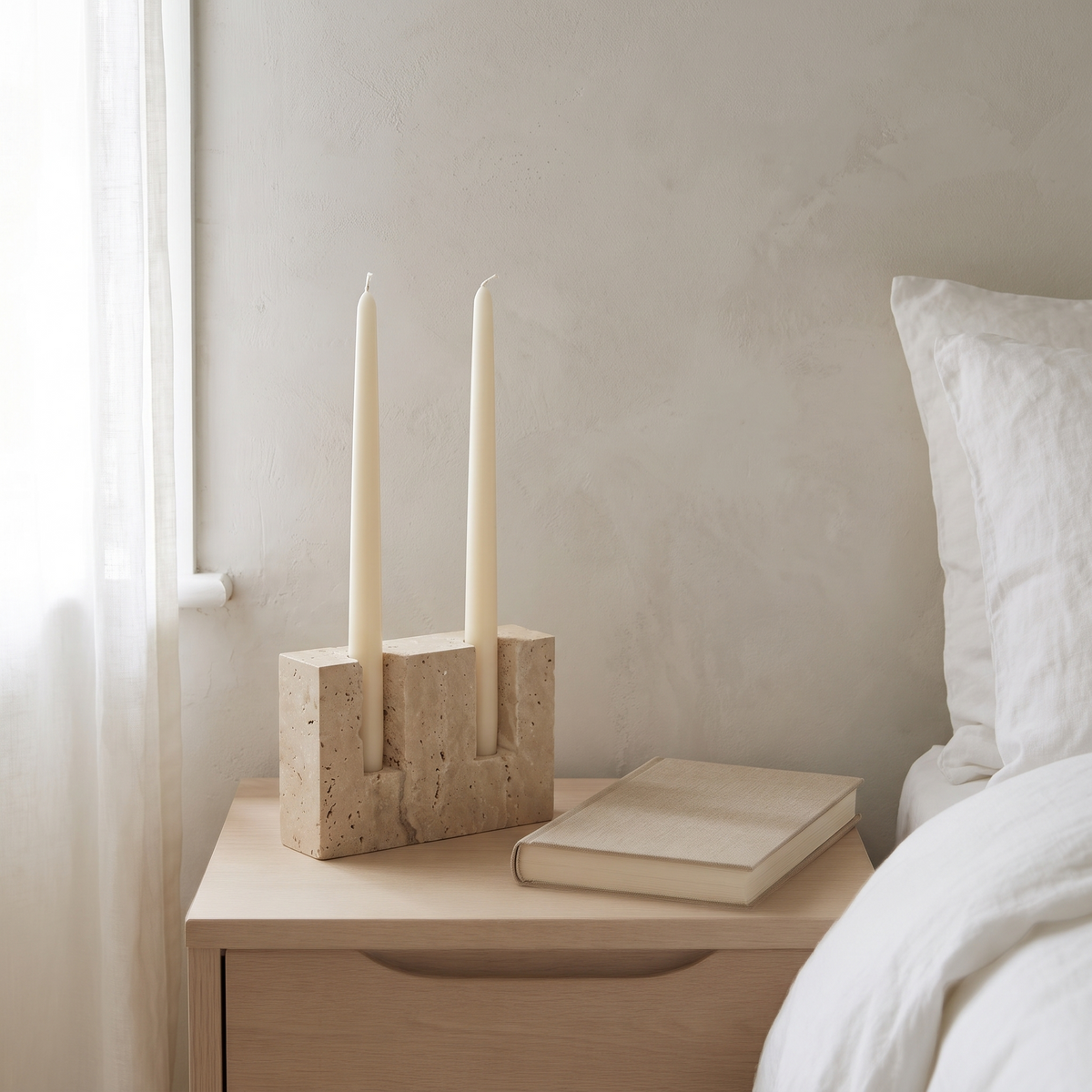 Helmsley travertine candle holder on a pale oak sideboard