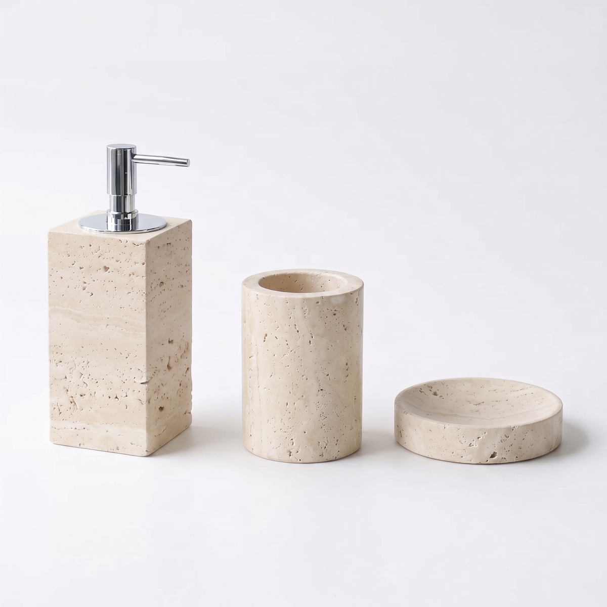 Malvern travertine soap dispenser, tumbler and soap dish on white