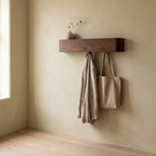 Eastnor walnut wall shelf in a hallway with keys and a bag