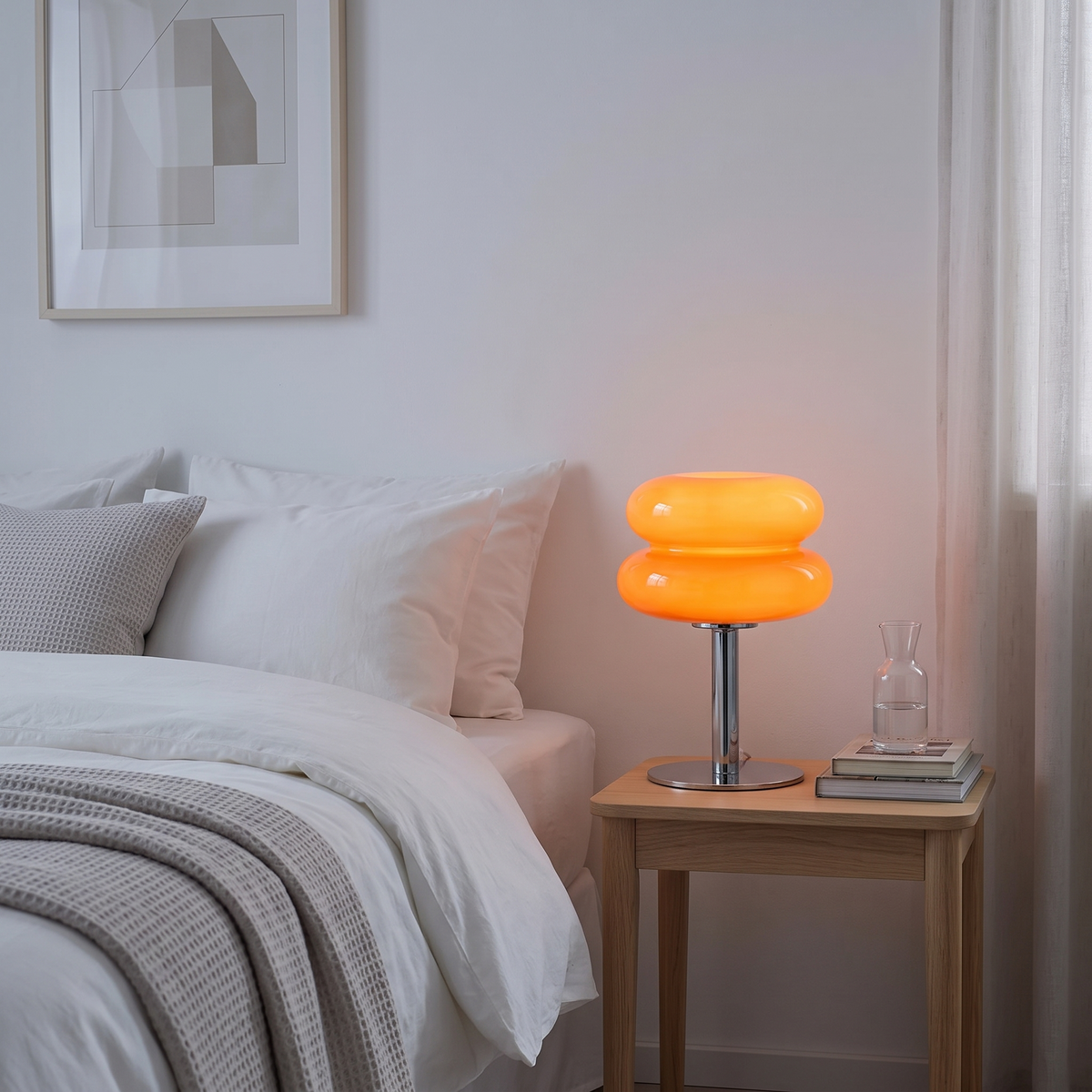 Orange Fulda lamp glowing on a bedside table