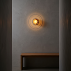 Rauma wall light glowing in a hallway