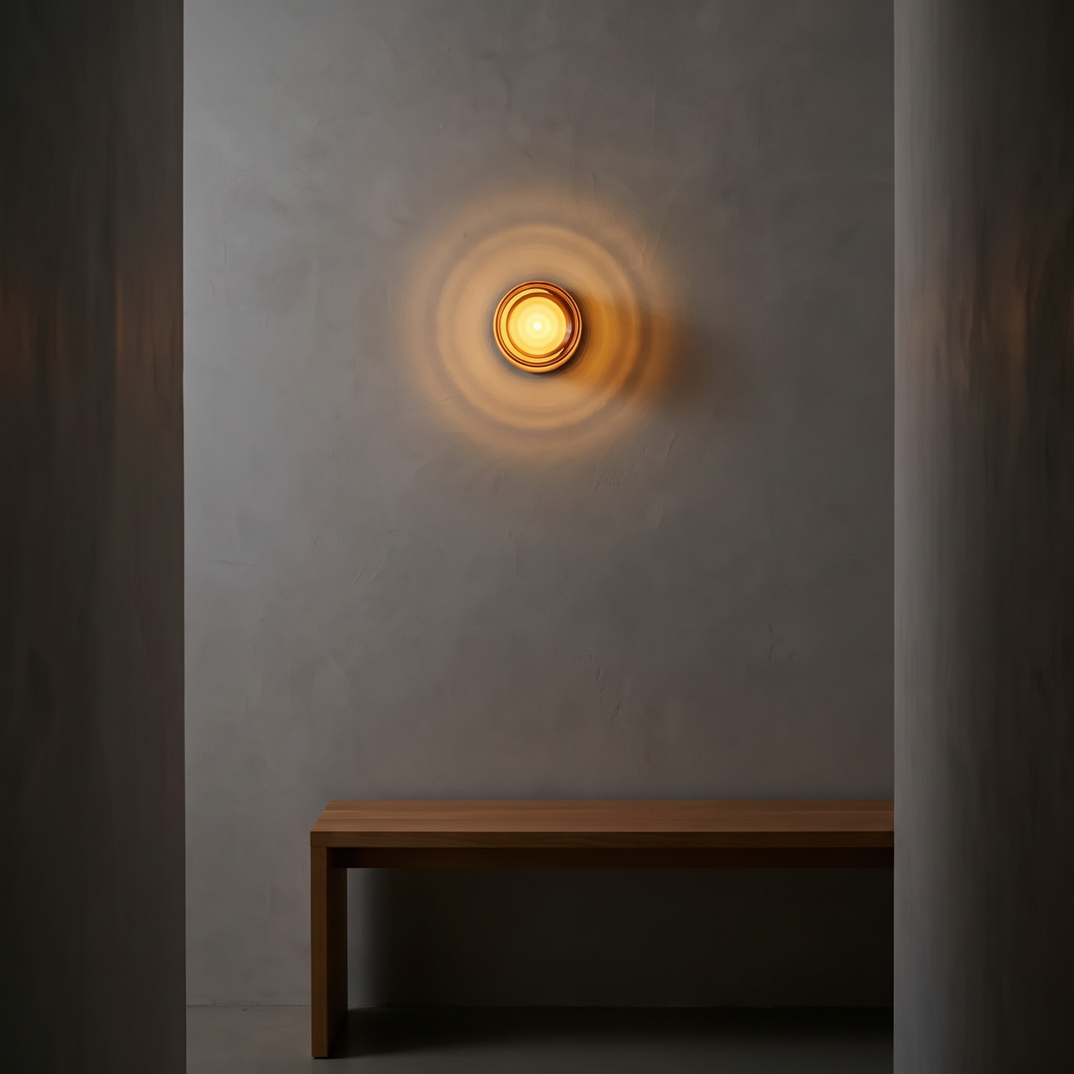 Rauma wall light glowing in a hallway
