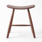 Herning saddle stool in walnut, side profile