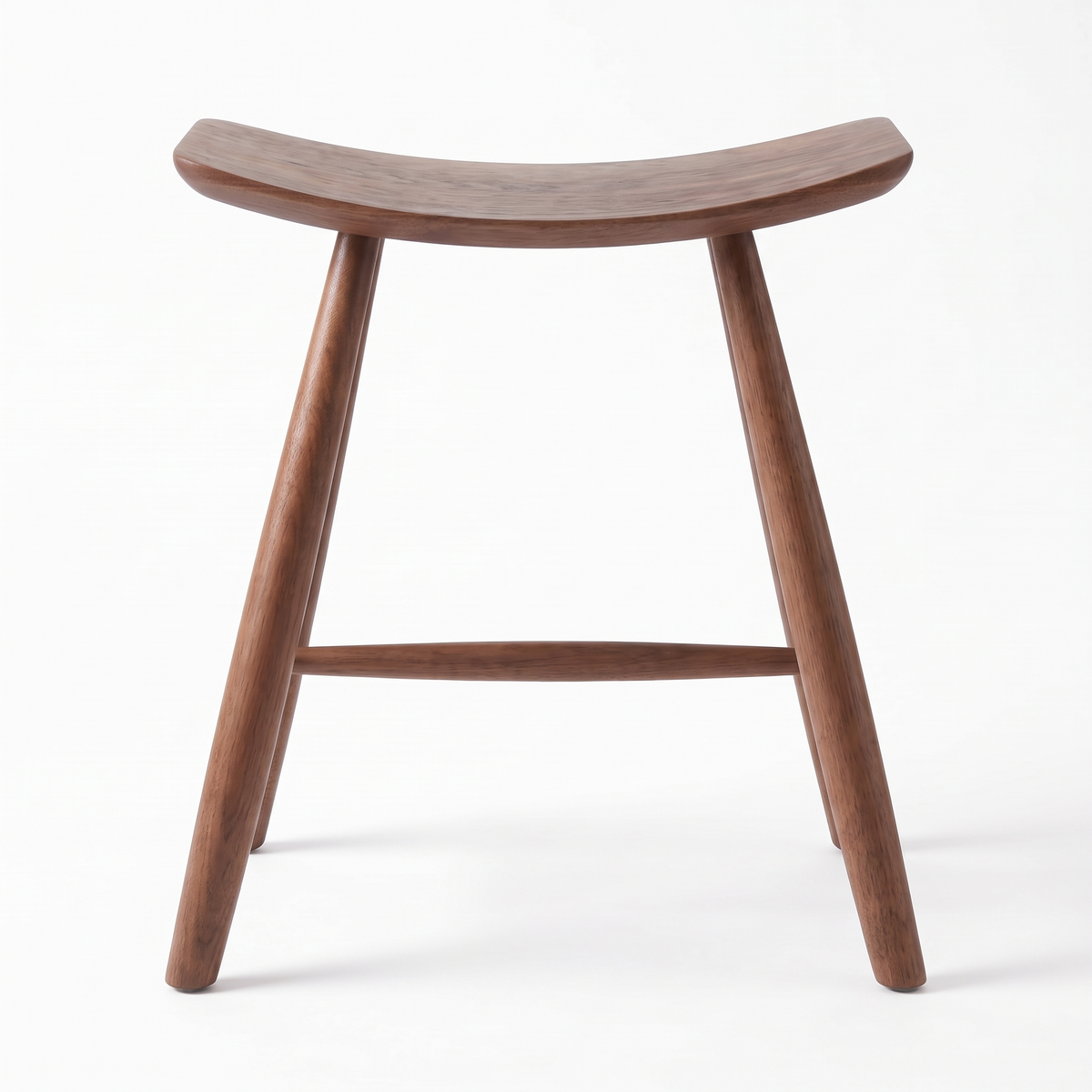 Herning saddle stool in walnut, side profile