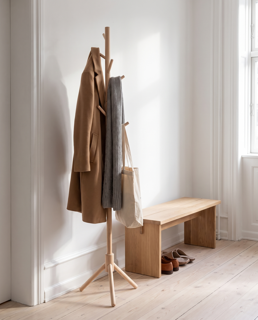 Goslar natural coat stand in a hallway with a coat and scarf