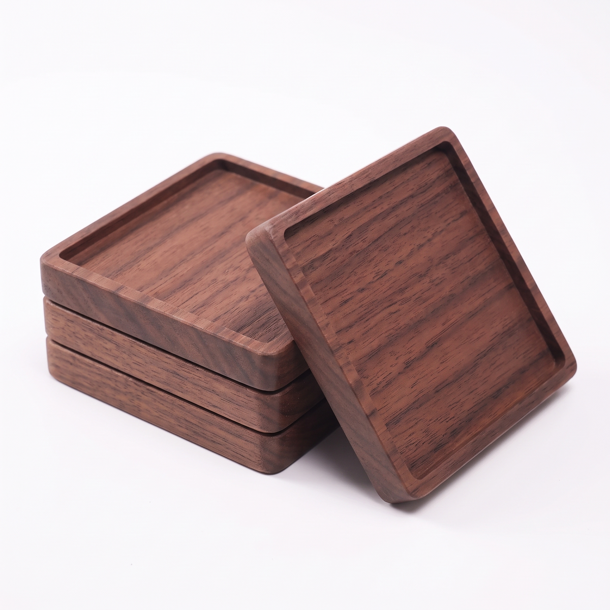 Aalborg square walnut coasters on white