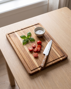 Lubeck board with tomatoes and a knife