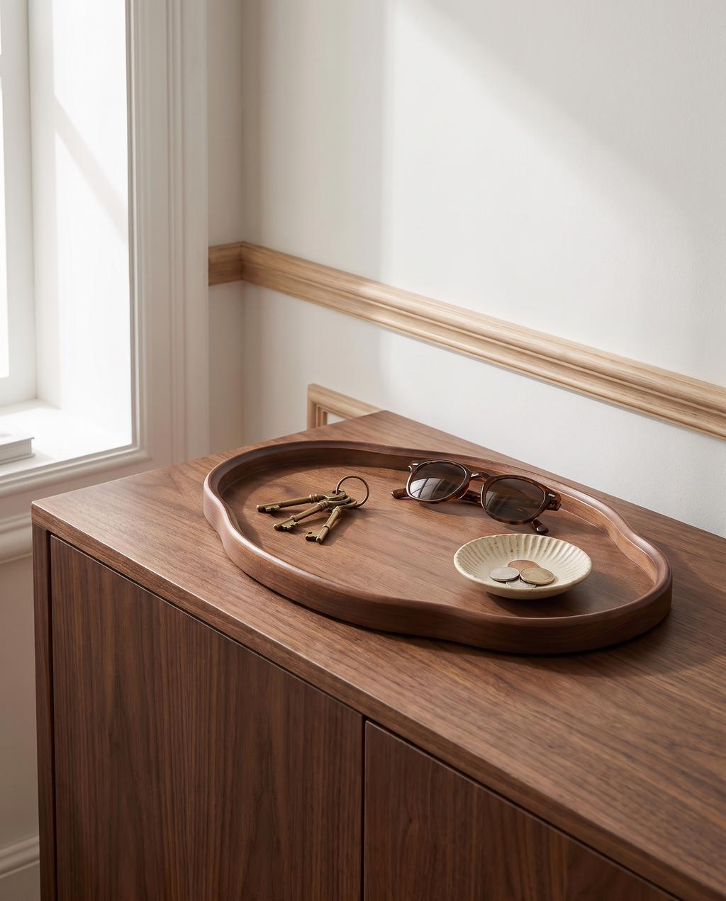 Trier tray holding keys on a sideboard
