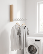 Kolding natural and white hanger drying shirts in a utility room