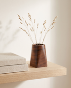 Rostock round walnut pot with dried stems on a shelf