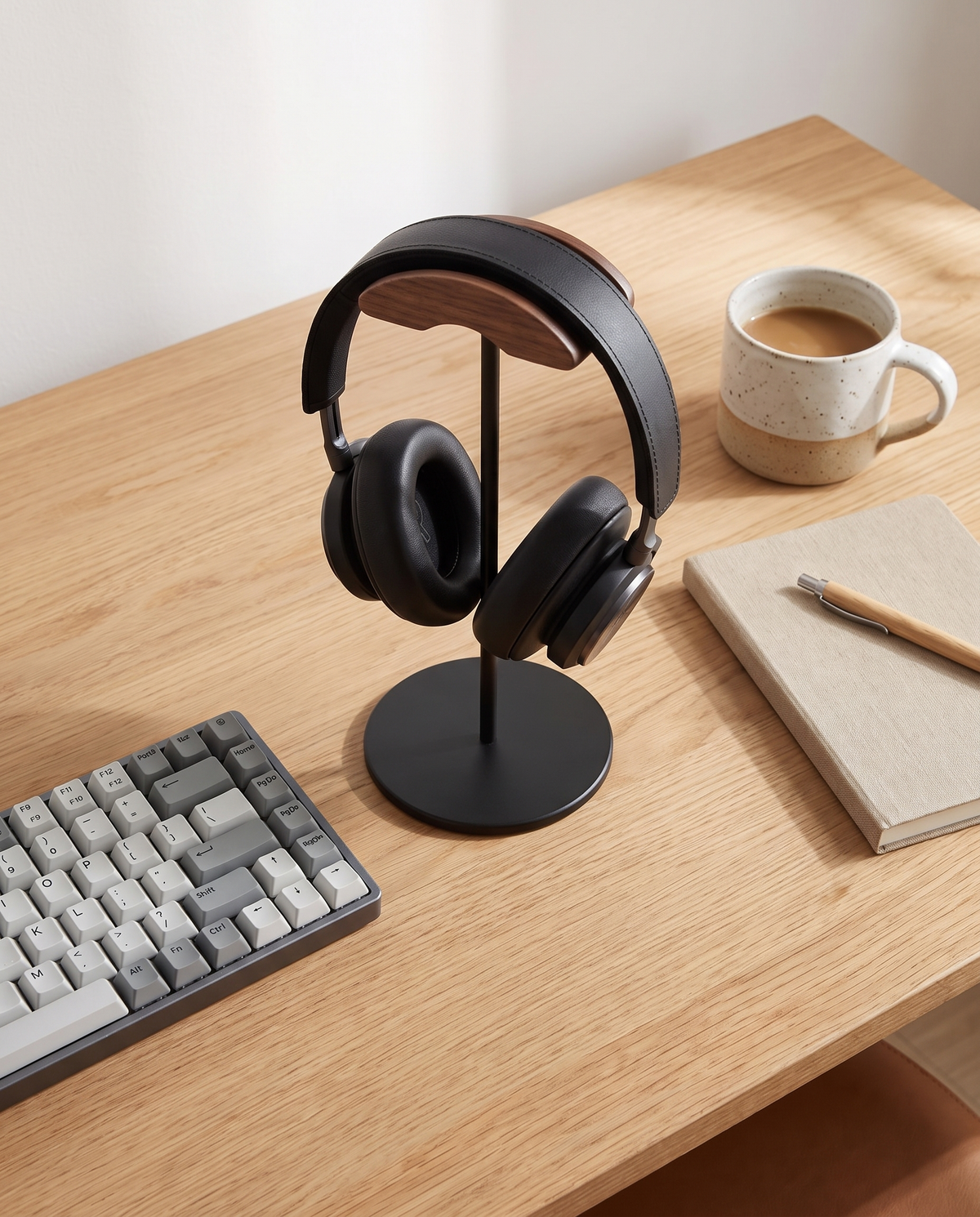 Marburg black headphone stand on an oak desk from above