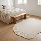 Skanor cream waves rug in a bedroom